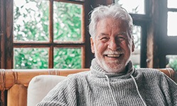 Closeup of senior man smiling at home