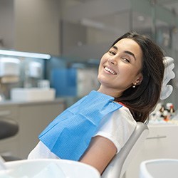 Smiling dental patient in treatment chair